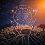 Colorful astrology chart with tarot cards and planetary model, mystical spiritual reading concepts.